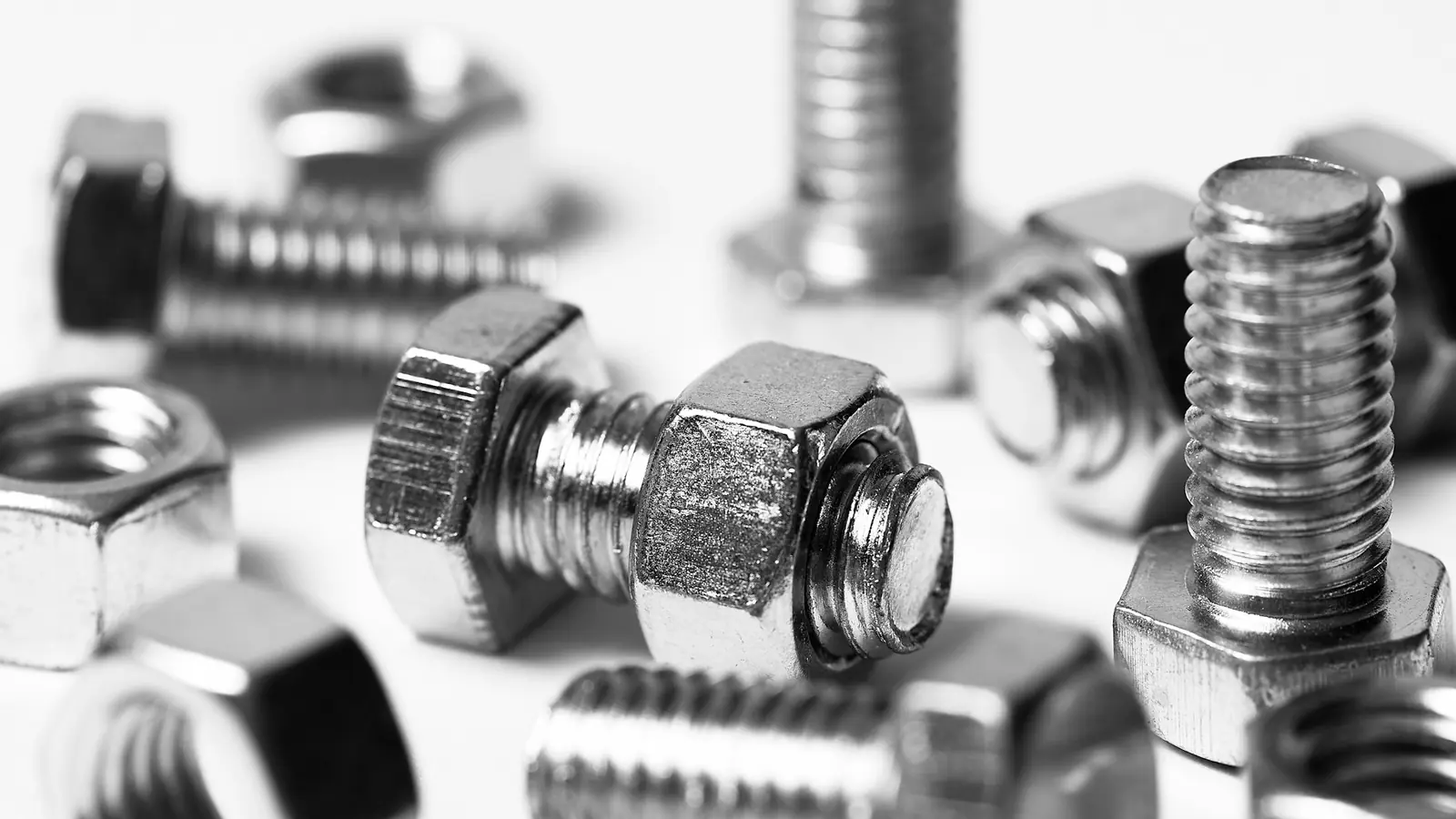 Steel hex bolts and nuts in close-up, a typical commodity kitty.